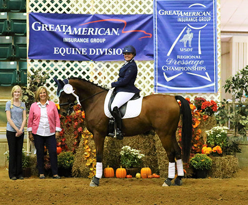 woman posing with her horse